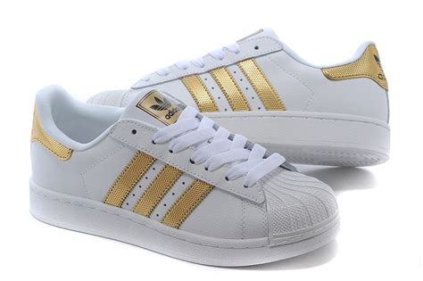 adidas schuhe mit goldenen streifen|Adidas superstar blau.